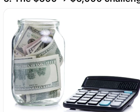 A savings jar filled with cash beside a calculator for the $500-a-month challenge